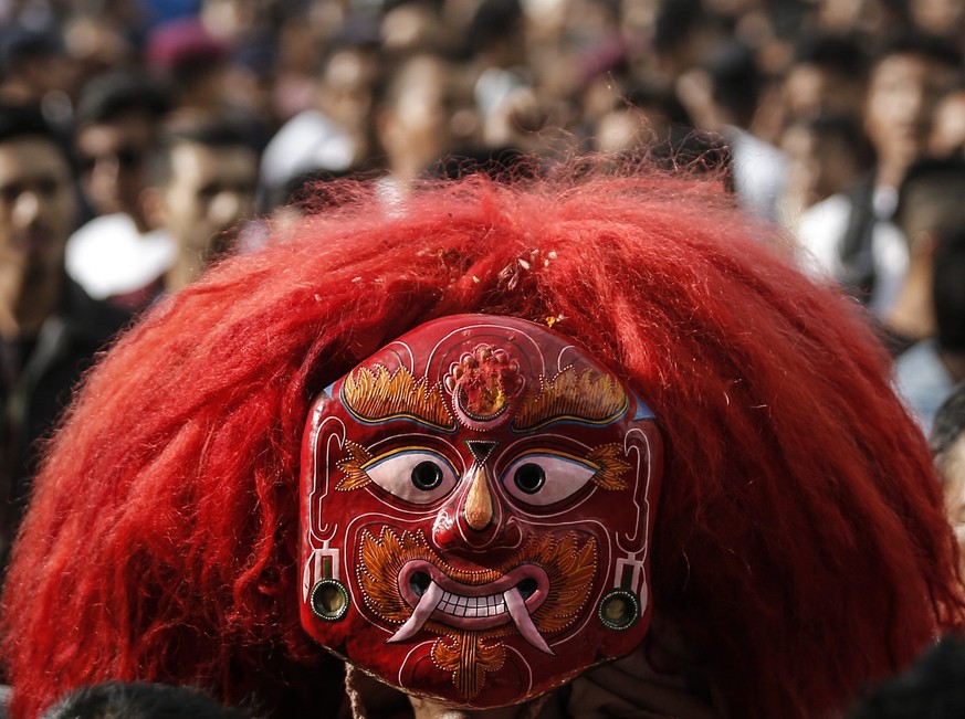 epa05540777 A Nepalese devotee wearing a mask locally known as &#039;Lakhe&#039; performs a dance during the procession on the third day of the Indra Jatra festival at Basantapur Durbar Square in Kath ...