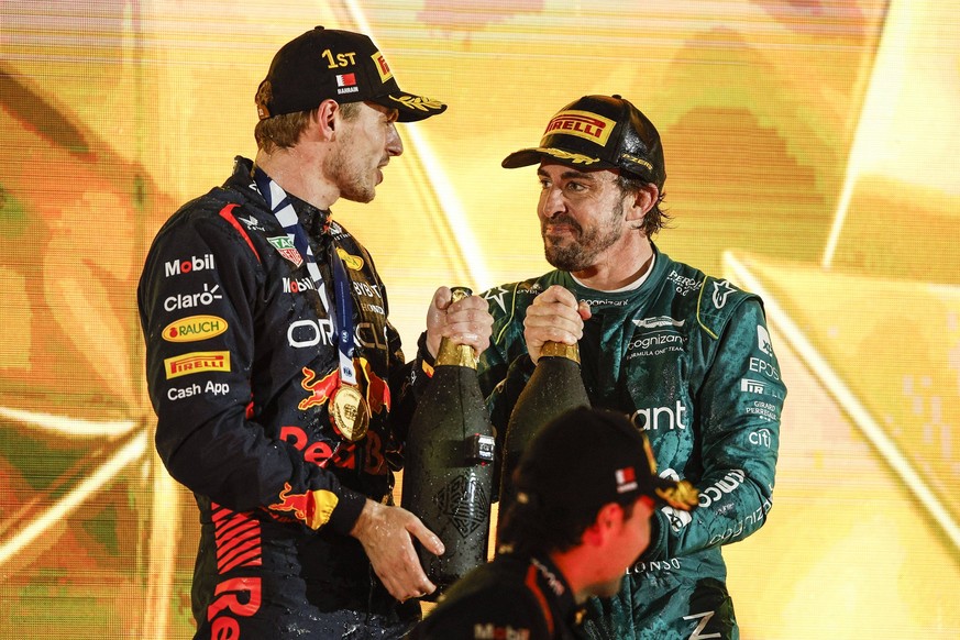 VERSTAPPEN Max ned, Red Bull Racing RB19, portrait ALONSO Fernando spa, Aston Martin F1 Team AMR23, portrait celebration podium during the Formula 1 Gulf Air Bahrain Grand Prix 2023, 1st round of the  ...