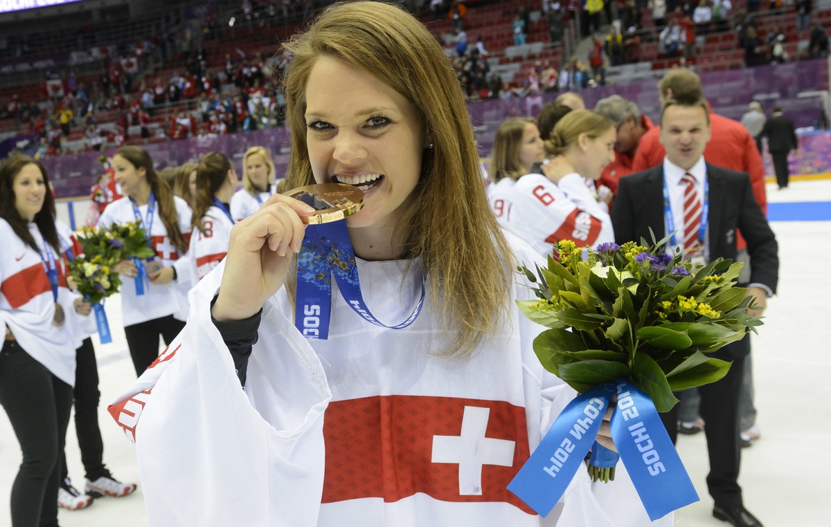 Switzerland's ice hockey women goalkeeper Florence Schelling celebrates her bronze medal during the women's ice hockey victory ceremony at the XXII Winter Olympics 2014 Sochi, at the Bolshoy ...