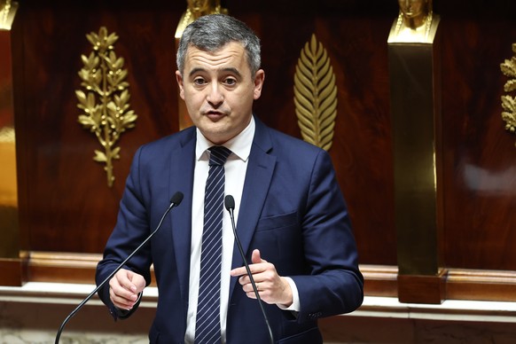 epa11023287 French Interior Minister Gerald Darmanin delivers a speech during a debate on the new immigration bill at the National Assembly in Paris, France, 11 December 2023. The deputies of the Nati ...