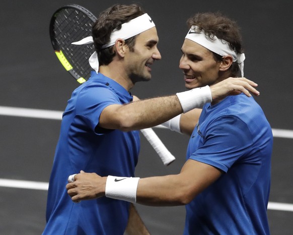 Europe&#039;s Roger Federer, left, and Rafael Nadal, right, celebrate after defeating World&#039;s Jack Sock and Sam Querrey in their Laver Cup doubles tennis match against in Prague, Czech Republic,  ...