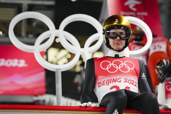 Simon Ammann, of Switzerland, prepares to jump during the men&#039;s normal hill individual ski jumping trial round at the 2022 Winter Olympics, Sunday, Feb. 6, 2022, in Zhangjiakou, China. (AP Photo/ ...