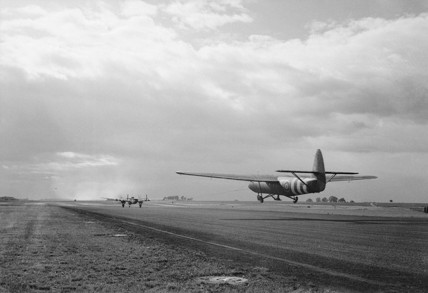 D-day - British Forces during the Invasion of Normandy 6 June 1944 A Horsa glider carrying troops of 6th Airlanding Brigade is towed aloft by an Armstrong Whitworth Albemarle at an RAF airfield, part  ...