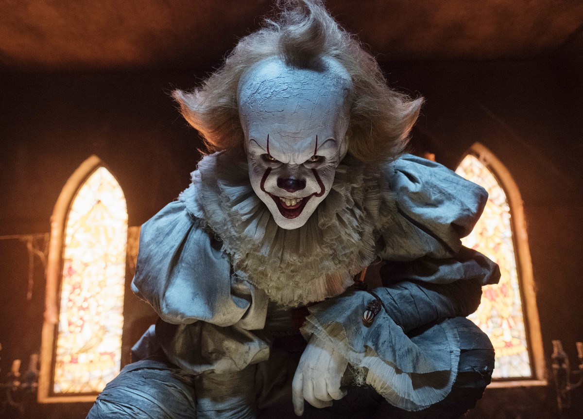 This image released by Warner Bros. Pictures shows Bill Skarsgard as the evil clown Pennywise in a scene from the film "It," based on the book by Stephen King. (Brooke Palmer/Warner Bros. Pi ...