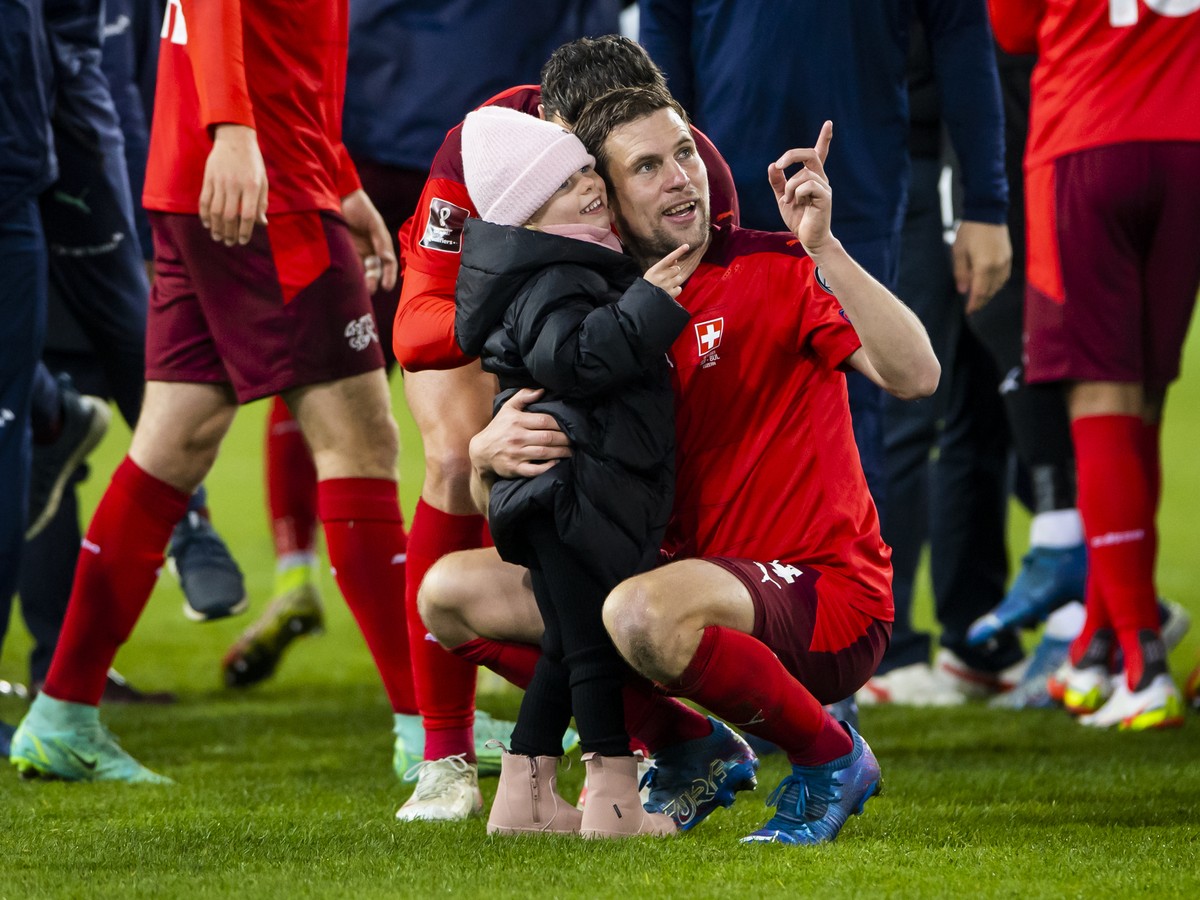 Switzerland's soccer players with Fabian Frei celebrate after directly qualifying for the FIFA World Cup Qatar 2022 during the 2022 FIFA World Cup European Qualifying Group C match between Switze ...