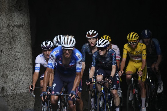 Belgium&#039;s Remco Evenepoel, wearing the best young rider&#039;s white jersey, left, Denmark&#039;s Jonas Vingegaard, center, and Slovenia&#039;s Tadej Pogacar, wearing the overall leader&#039;s ye ...
