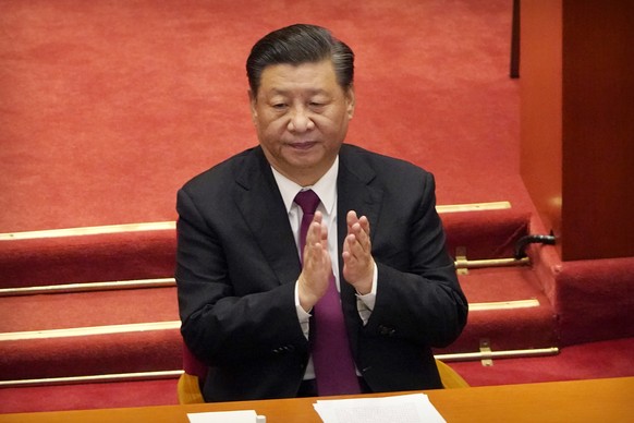 FILE - Chinese President Xi Jinping applauds during the closing session of the Chinese People&#039;s Political Consultative Conference (CPPCC) at the Great Hall of the People in Beijing, Wednesday, Ma ...