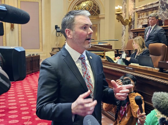 Minnesota Senate Republican Minority Leader Mark Johnson talks with reporters on the Senate floor in the Minnesota State Capitol after a Republican attempt to expedite an ethics investigation of Democ ...
