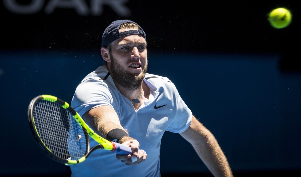 epa06409955 Jack Sock of the USA in action against Karen Khachanov of Russia during their match of the men's singles on day one of the Hopman Cup tennis tournament at Perth Arena in Perth, Wester ...