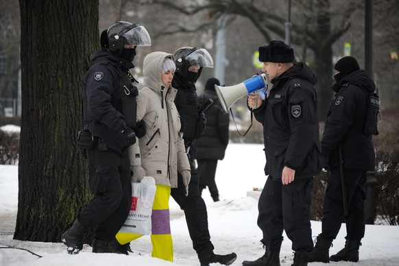 Police detain a man as he wanted to lay flowers paying their last respect to Alexei Navalny at the monument, a large boulder from the Solovetsky islands, where the first camp of the Gulag political pr ...