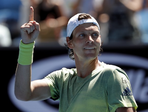 Tomas Berdych of the Czech Republic reacts after defeating Italy&#039;s Fabio Fognini during their fourth round match at the Australian Open tennis championships in Melbourne, Australia, Monday, Jan.  ...