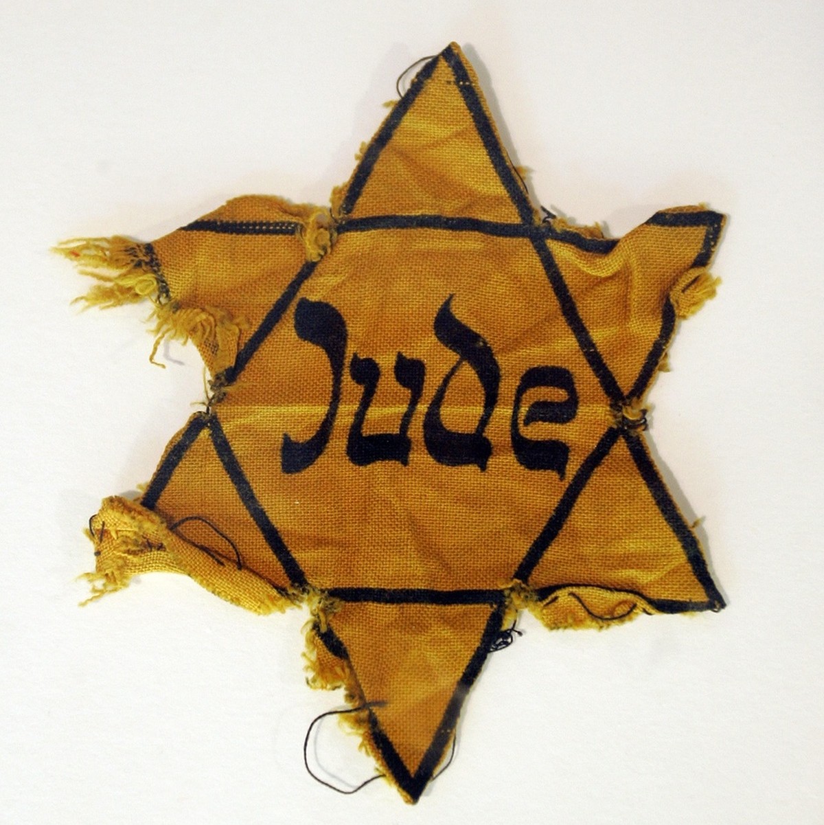A slightly torn yellow star of David is on display at the Museum Otto Weidt's Workshop for the Blind at 39 Rosenthaler Strasse in Berlin, April 17, 2007. Weidt, who owned a brush-making company d ...