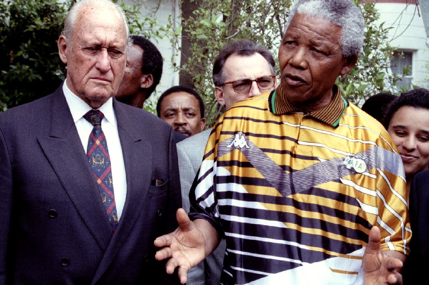 South African President Nelson Mandela speaks next to FIFA President Joao Havelange (L) in South Africa January 12, 1996. REUTERS/Patrick de Noirmont/File photo