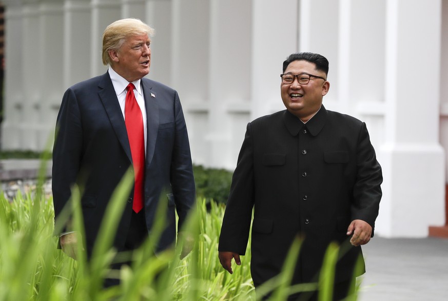 FILE - In this June 12, 2018, file photo, U.S. President Donald Trump, left, and North Korea leader Kim Jong Un walk from their lunch at the Capella resort on Sentosa Island in Singapore. The most sen ...