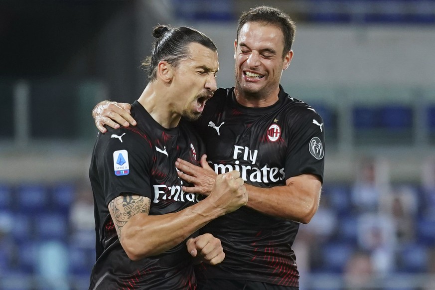 AC Milan&#039;s Zlatan Ibrahimovic, left, celebrates with Giacomo Bonaventura after scoring his side&#039;s 2nd goal on a penalty, during the Serie A soccer match between Lazio and AC Milan at the Rom ...