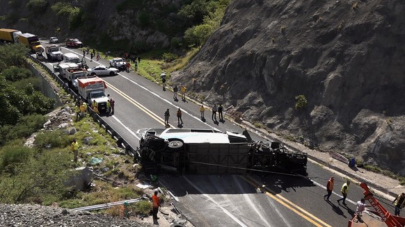 epa10814507 A passenger bus after an accident in the municipality of Tepelmeme, Oaxaca state, Mexico, 22 August 2023. Authorities in Oaxaca, a state in southern Mexico, confirmed that there are migran ...