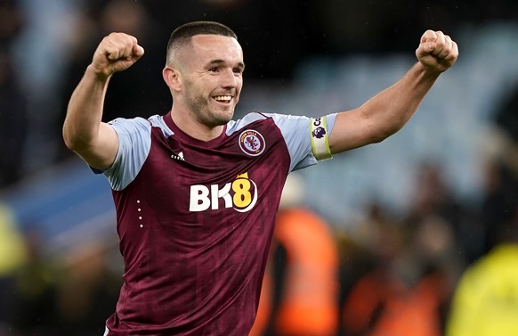 epa11020082 Aston Villa captain John McGuinn celebrates after winning the English Premier League match between Aston Villa and Arsenal in Birmingham, Britain, 09 December 2023. Aston Villa won 1-0 wit ...