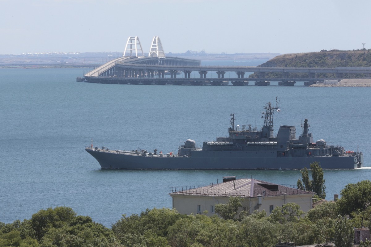 FILE - A Russian military landing ship, which now transports cars and people between Crimea and Taman because the Crimean Bridge connecting Russian mainland and Crimean peninsula over the Kerch Strait ...