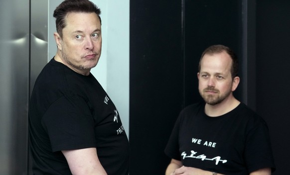 Tesla CEO Elon Musk, left, and Andr