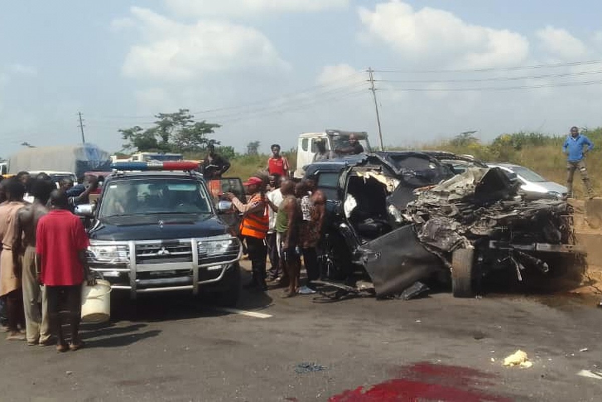 In this photo provided by the Federal Road Safety Corps, people gather at the accident scene of British boxer Anthony Joshua in Lagos, Nigeria, on Monday, Dec. 29, 2025. (Federal Road Safety Corps via ...
