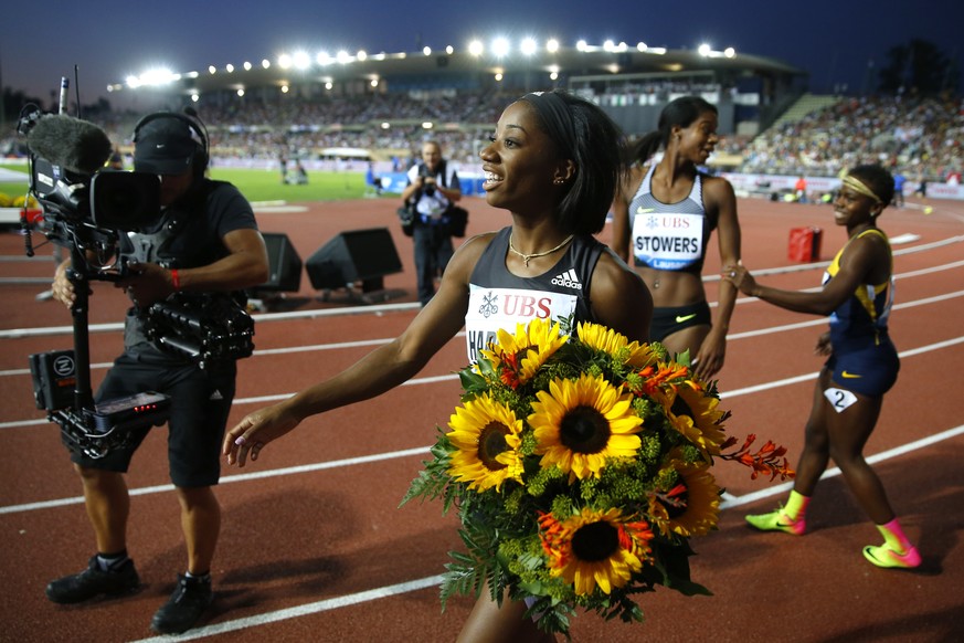 Kendra Harrison from the USA celebrates after winning the women&#039;s 100m hurdles race at the Athletissima IAAF Diamond League international athletics meeting in the Stade Olympique de la Pontaise i ...