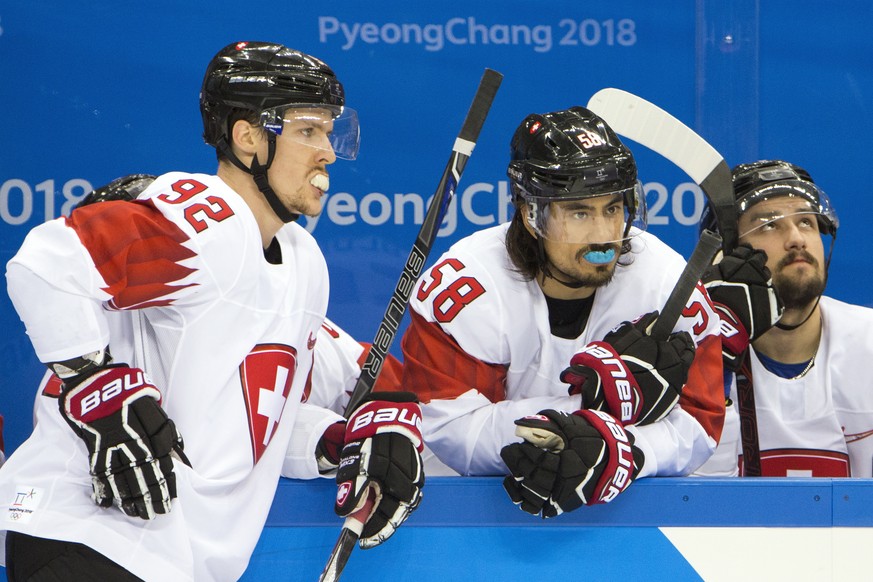 Gaetan Haas of Switzerland, Eric Blum of Switzerland, and Vincent Praplan of Switzerland, from left, during the men ice hockey preliminary round match between Switzerland and Czech Republic in the Gan ...