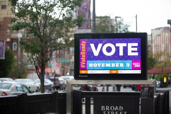 epa08797120 A sign reminds people to vote in Philadelphia, Pennsylvania, USA, 03 November 2020. Americans vote on Election Day to choose between re-electing Donald J. Trump or electing Joe Biden as th ...