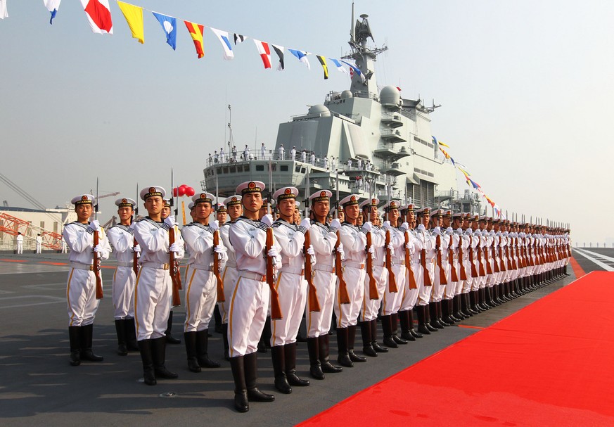 FILE - In this Sept. 25, 2012 file photo provided by China&#039;s Xinhua News Agency, sailors stand at attention on the deck of China&#039;s aircraft carrier &quot;Liaoning&quot; in Dalian, northeast  ...