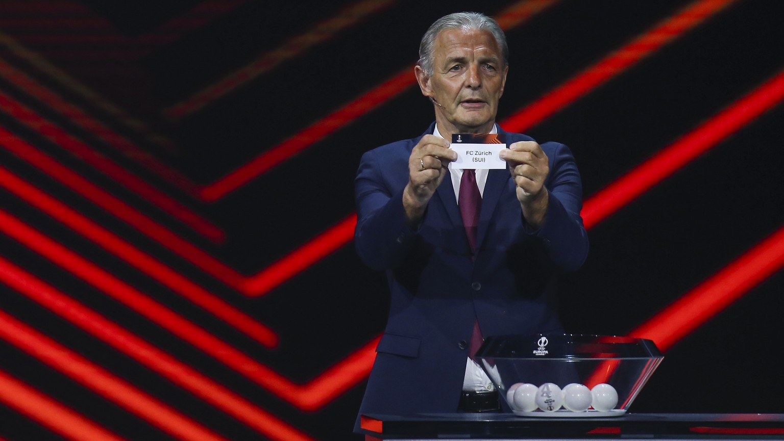 German former player Karl-Heinz &quot;Charly&quot; Korbel shows the name of FC Zurich during the soccer Europa League draw in Istanbul, Turkey, Friday, Aug. 26, 2022. (AP Photo/Emrah Gurel)
Karl-Heinz ...