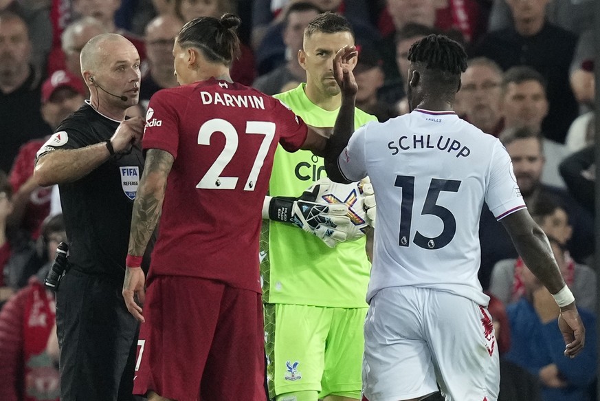 epa10123252 Referee Paul Tierney (L) talks to Liverpool&#039;s Darwin Nunez (C) during the English Premier League soccer match between Liverpool FC and Crystal Palace in Liverpool, Britain, 15 August  ...