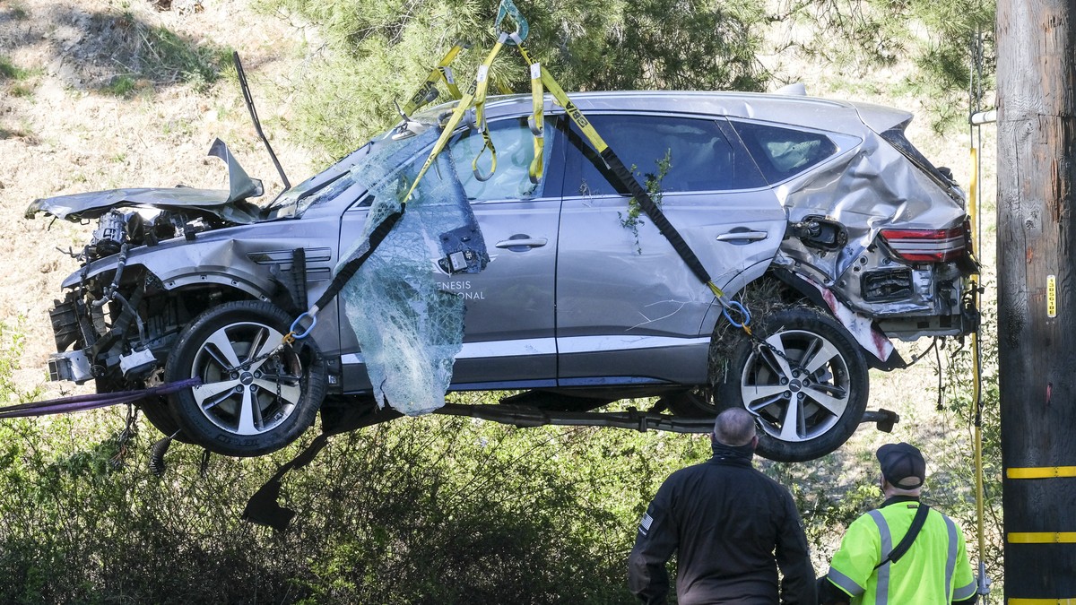 FILE - In this Feb. 23, 2021, file photo, a crane is used to lift a vehicle following a rollover accident involving golfer Tiger Woods, in the Rancho Palos Verdes suburb of Los Angeles. The Los Angele ...