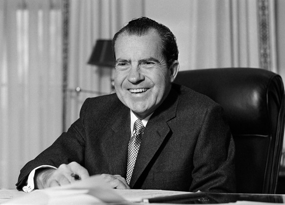 FILE - This Jan. 21, 1969 file photo shows President Richard Nixon at his desk at the White House in Washington. Nixon suffered a stroke in 1994 and died days later at age 81. Thursday, Aug. 7, 2014 m ...