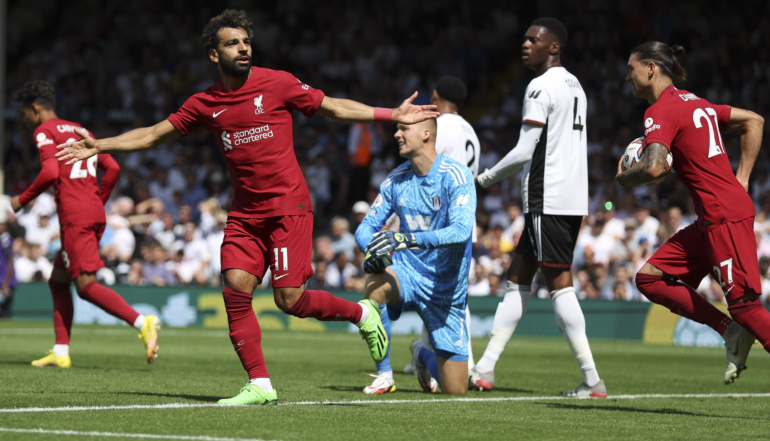 Liverpool&#039;s Mohamed Salah, leftt, celebrates after scoring during the English Premier League soccer match between Fulham and Liverpool at Craven Cottage stadium in London, Saturday, Aug. 6, 2022. ...