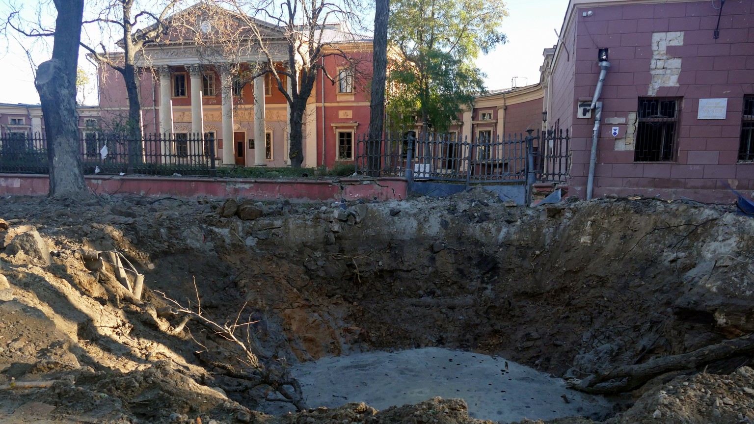 epa10960288 A view of a shell crater near an art museum after overnight shelling in Odesa, southern Ukraine, 06 November 2023, amid the Russian invasion. At least eight people were injured as a result ...