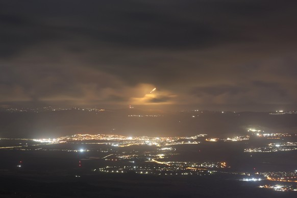epa11606506 Israeli artillery fire flares over an area in southern Lebanon, as seen from an undisclosed location in the Upper Galilee, northern Israel on 15 September 2024. The Israeli military stated ...