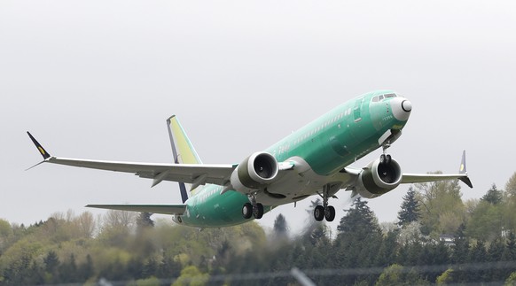 FILE - In this Wednesday, April 10, 2019 file photo, a Boeing 737 MAX 8 airplane being built for India-based Jet Airways, takes off on a test flight at Boeing Field in Seattle. A global team of expert ...