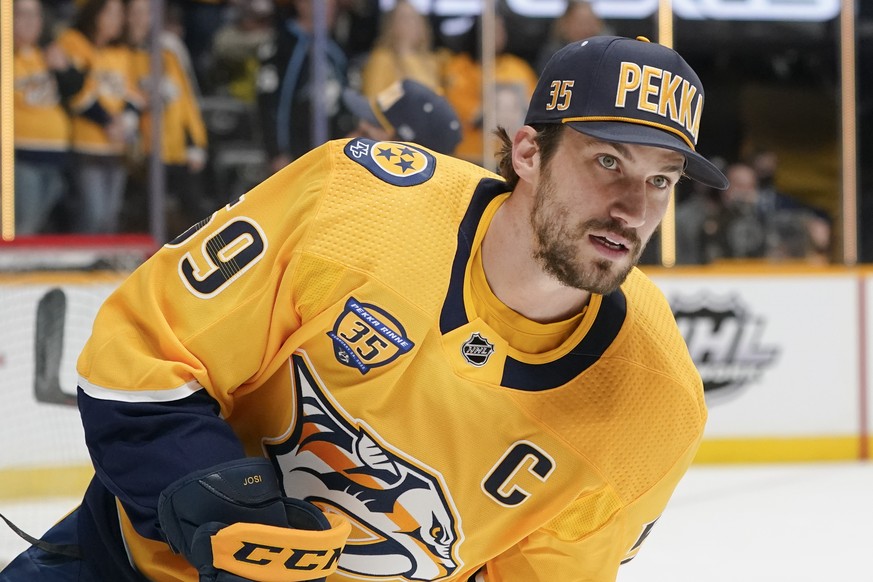 Nashville Predators captain Roman Josi wears a Pekka Rinne cap as he warms up before an NHL hockey game against the Dallas Stars Thursday, Feb. 24, 2022, in Nashville, Tenn. Former Nashville Predators ...