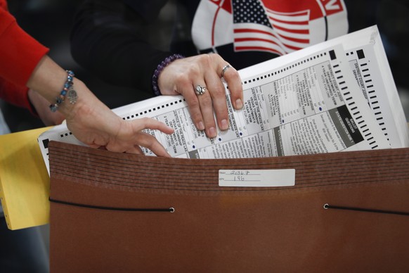 epaselect epa10297192 An election worker prepares ballots to be processed at the Clark County Election Department in North Las Vegas, Nevada, USA, 09 November 2022. The US midterm elections are held e ...