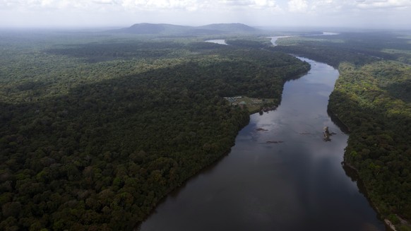 The Essequibo River flows through Kurupukari crossing in Guyana, Saturday, Nov. 19, 2023. Venezuela has long claimed Guyana?s Essequibo region, a territory larger than Greece and rich in oil and miner ...
