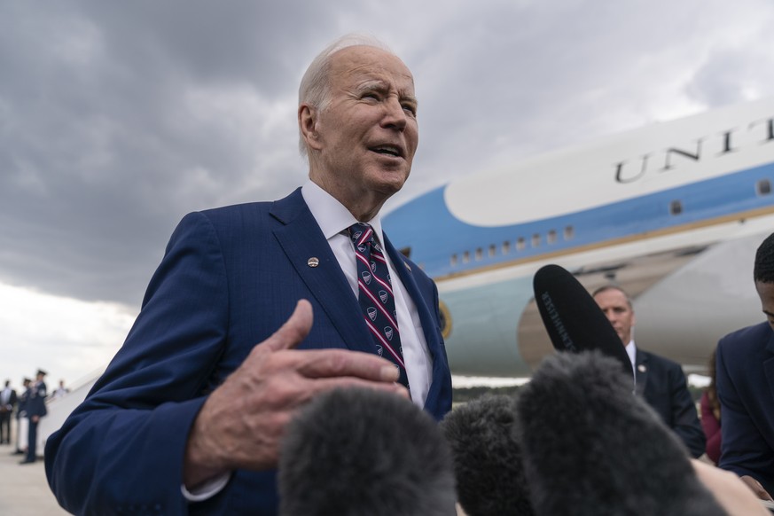 President Joe Biden speaks to reporters before boarding Air Force One at Raleigh-Durham International Airport in Morrisville, N.C., Tuesday, March 28, 2023, en route to Washington. (AP Photo/Carolyn K ...