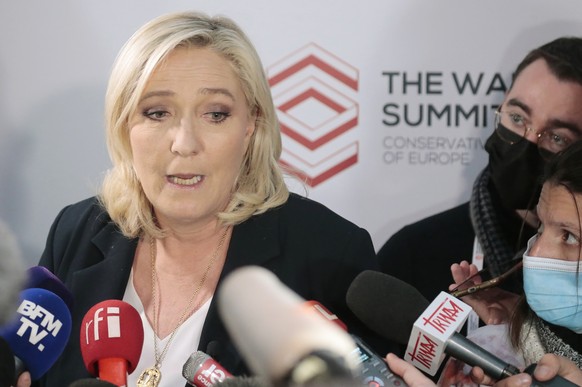 The French far-right party leader Marine Le Pen attends a press conference with reporters in Warsaw, Poland, Saturday, Dec. 4, 2021. The leaders of right-wing populist parties met to discuss how they  ...