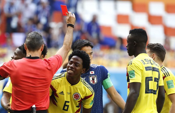 epa06820803 Carlos Sanchez (C) of Colombia receives the red card during the FIFA World Cup 2018 group H preliminary round soccer match between Colombia and Japan in Saransk, Russia, 19 June 2018.

( ...