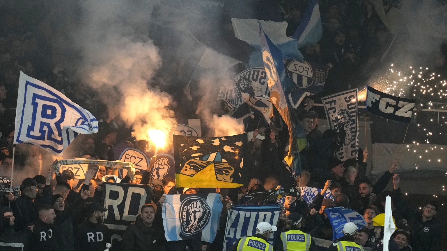 Zurich fans in the stands let off flares during the Europa League Group A soccer match between Arsenal and FC Zurich at the Emirates stadium in London, Thursday, Nov. 3, 2022. (AP Photo/Frank Augstein ...