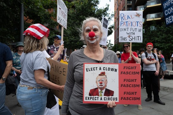 June 14, 2025, London, England, United Kingdom: Supporters of U.S.-based activist group Indivisible stage a demonstration outside the U.S. Embassy in London, as part of a global ��oeNo Tyrants��� day  ...
