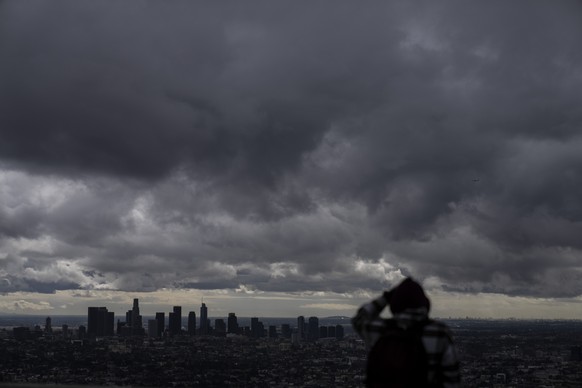 Storm clouds hover over Los Angeles, Thursday, Feb. 23, 2023. For the first time since 1989, the National Weather Service issued a blizzard warning for the Southern California mountains. (AP Photo/Jae ...