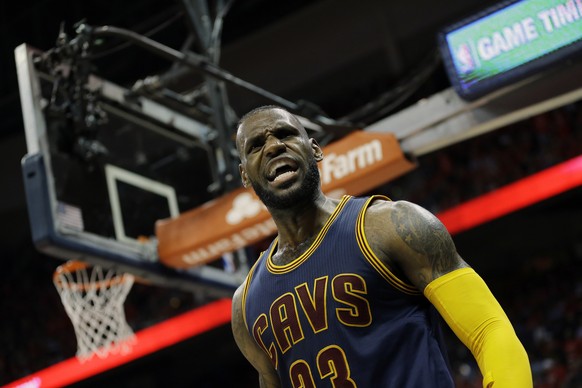 Cleveland Cavaliers forward LeBron James (23) reacts after making the basket and drawing a foul against the Atlanta Hawks during the second half in Game 2 of the Eastern Conference finals of the NBA b ...