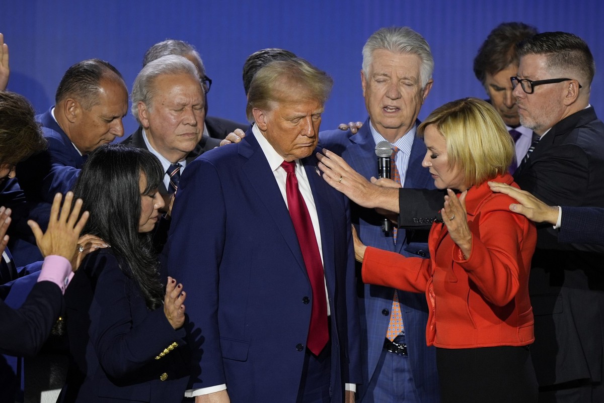 Republican presidential nominee former President Donald Trump is prayed over with Pastor Paula White during the National Faith Summit at Worship With Wonders Church, Monday, Oct. 28, 2024, in Powder S ...