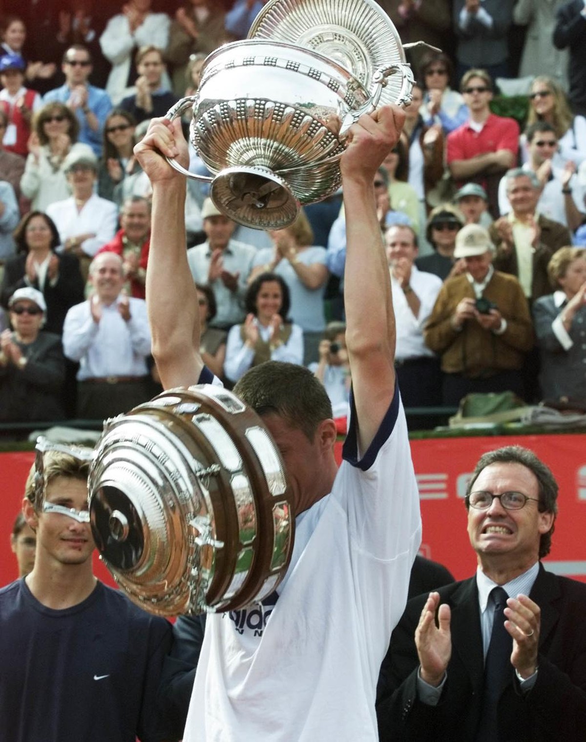 The bottom of the winners trophy drops off, as Russia's Marat Safin lifts it, after winning the Conde de Godo Tennis Open Sunday, April 30 2000 in Barcelona. Safin defeated Juan Carlos Ferrero of ...
