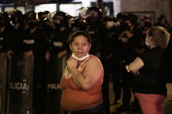 Relatives of inmates wait for news outside the Litoral penitentiary after a riot, in Guayaquil, Ecuador, Tuesday, Sept. 28, 2021. A police and military operation managed to regain control of the regio ...