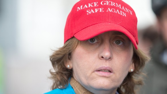 epa06194272 Beatrix von Storch, German Member of European Parliament of 'Alternative for Germany' (AfD) party wears a red cap with the inscription 'Make Germany safe again' prior t ...